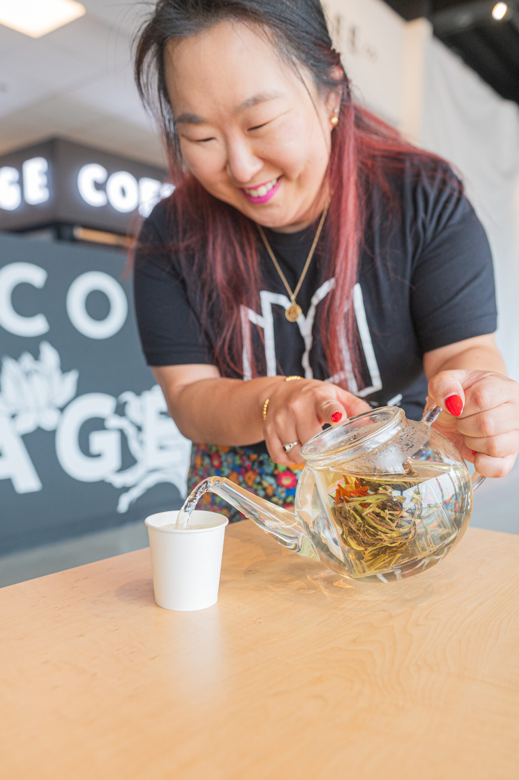 Christine Yom pours tea at Message Coffee.