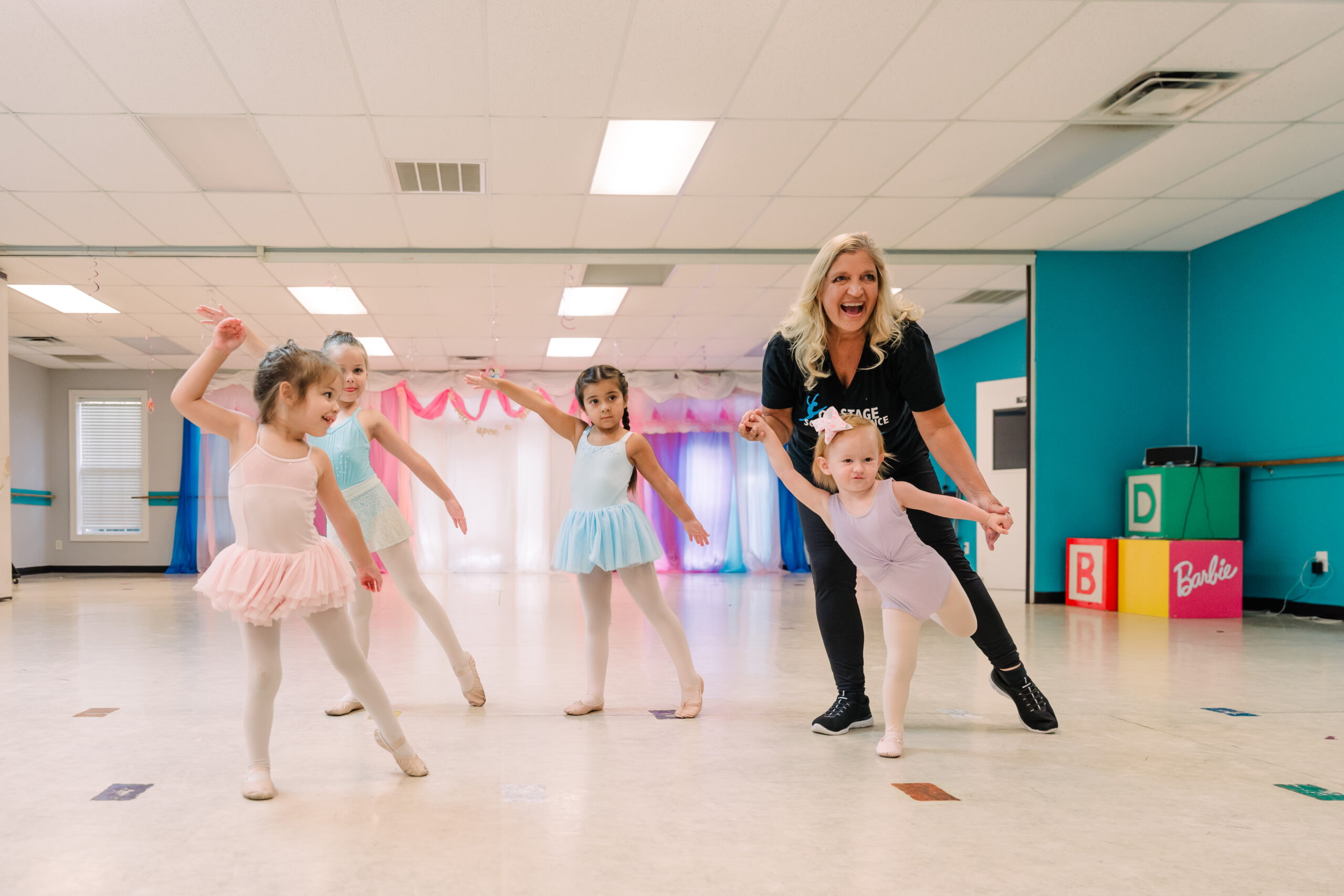 Lori fields helps kids in her dance classes.
