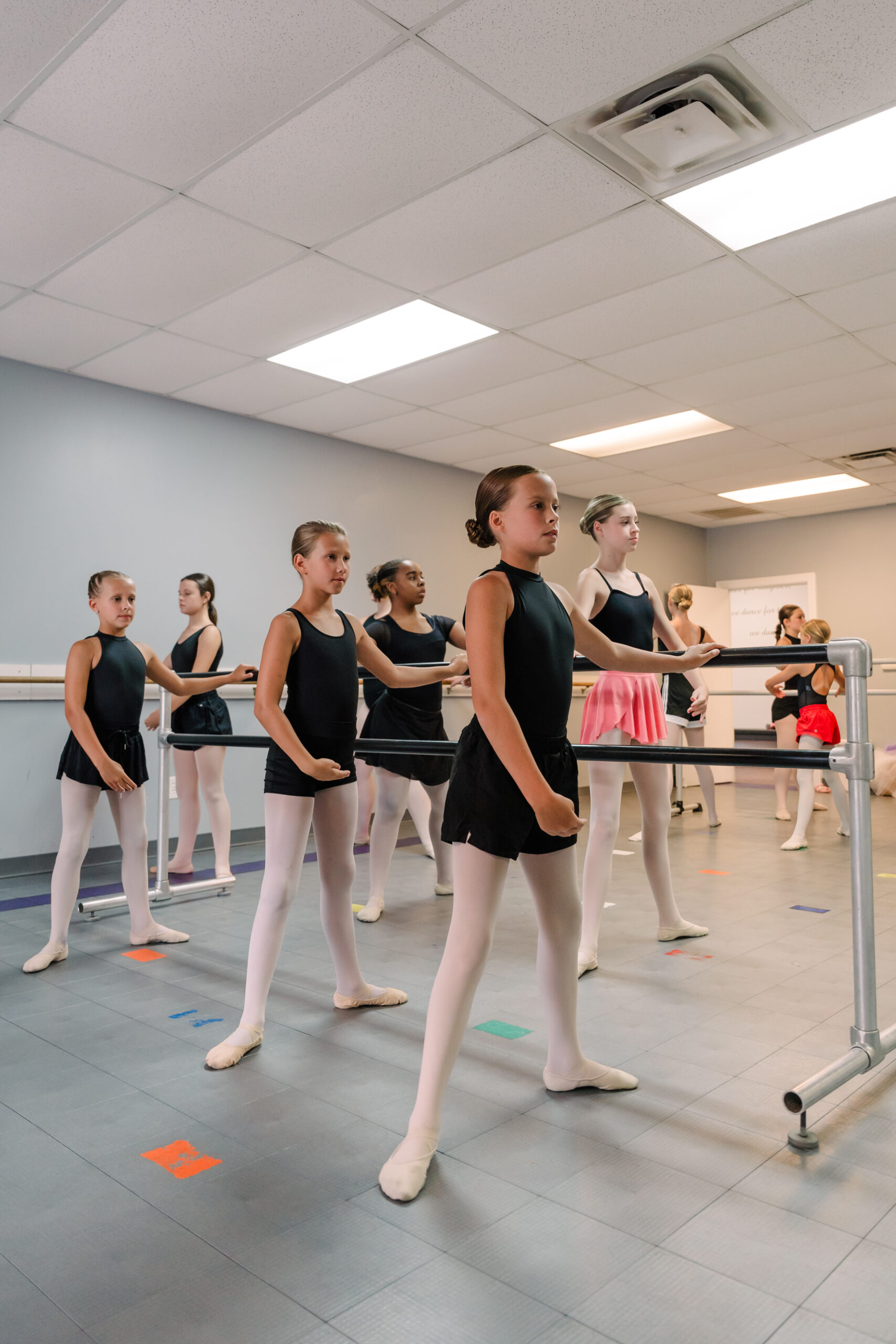 Dancers standing at the barre at the On Stage dance studio in High Point, NC.