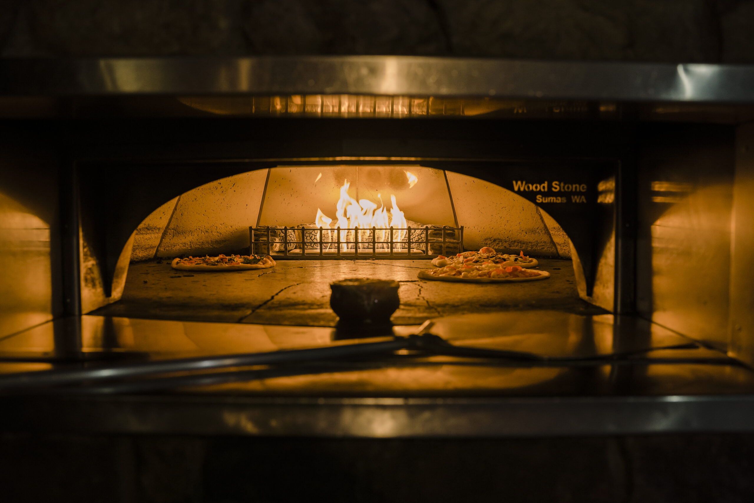 Pizza in the pizza oven at Giannos in High Point, NC
